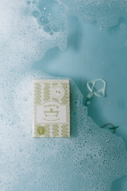 DrainWig hair catcher displayed in bathtub